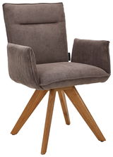 Moderner Armlehnstuhl mit braunem Cordbezug und Holzbeinen, seitliche Perspektive