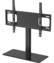 Schwarze TV-/Monitor-Tischhalterung aus Metall mit zentraler Säule, breiter Standplatte und VESA-Montageschienen, frontal in leichter Schrägansicht von links gezeigt.