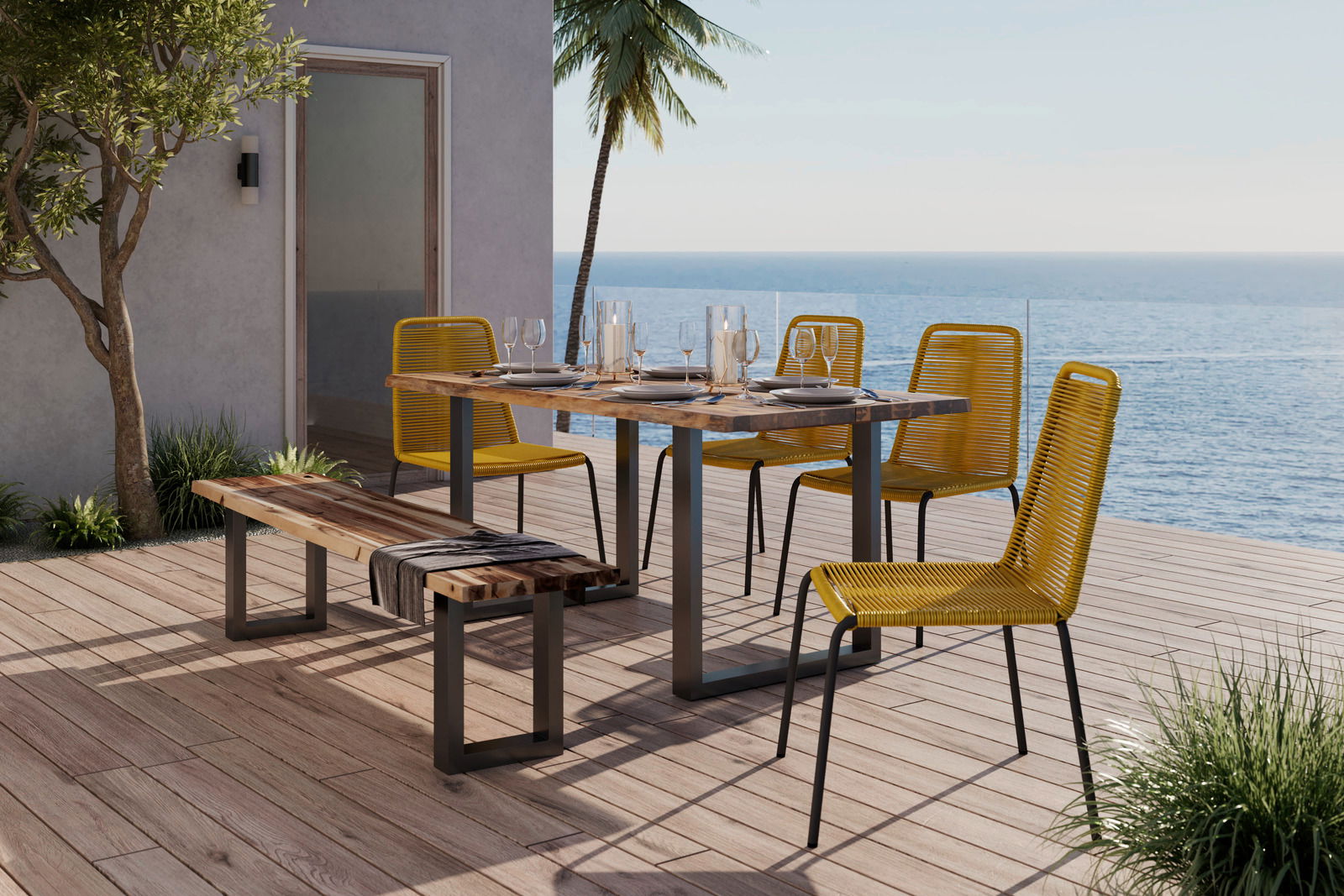 Gelber Stapelstuhl auf einer Terrasse mit Meerblick, neben einem Holztisch und einer Bank, seitliche Perspektive.