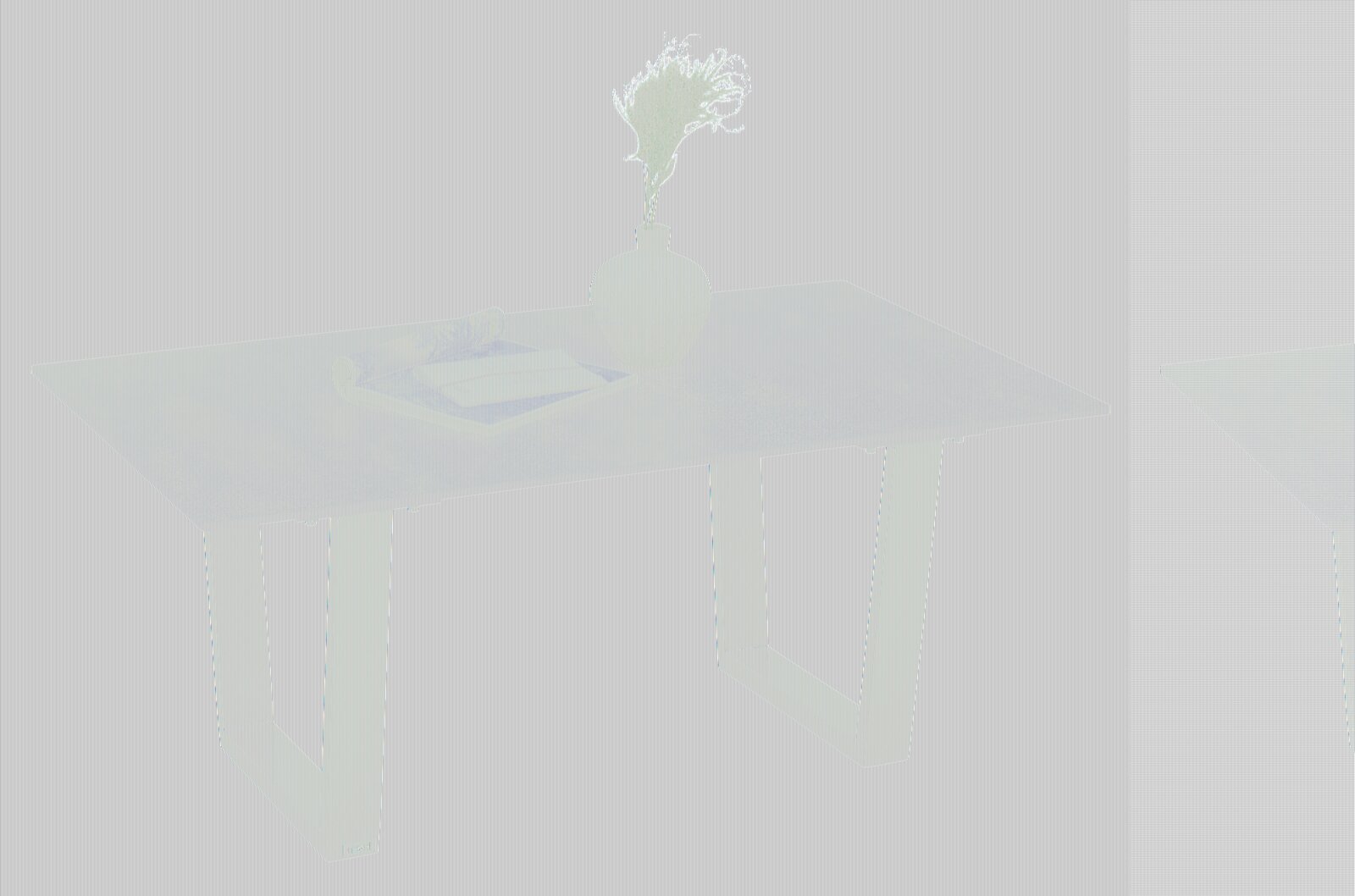 Moderner Couchtisch mit dunkler Tischplatte und silbernen Metallbeinen, seitliche Perspektive