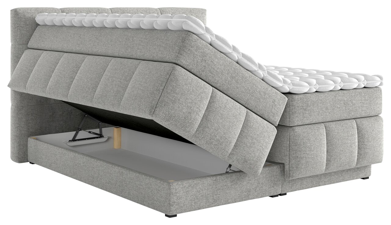 Boxspringbett mit geöffnetem Stauraum, seitliche Perspektive