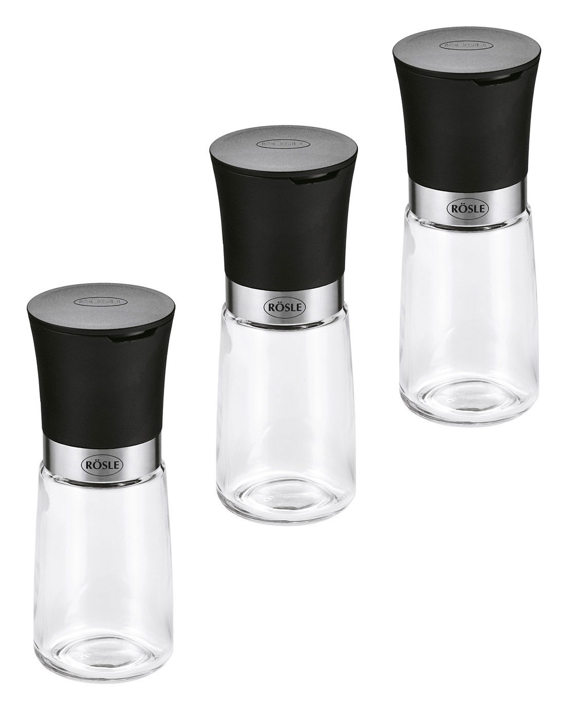 Dreiteiliges Gewürzmühlen-Set mit schwarzem Deckel und transparentem Glasbehälter, aus der Vogelperspektive fotografiert.