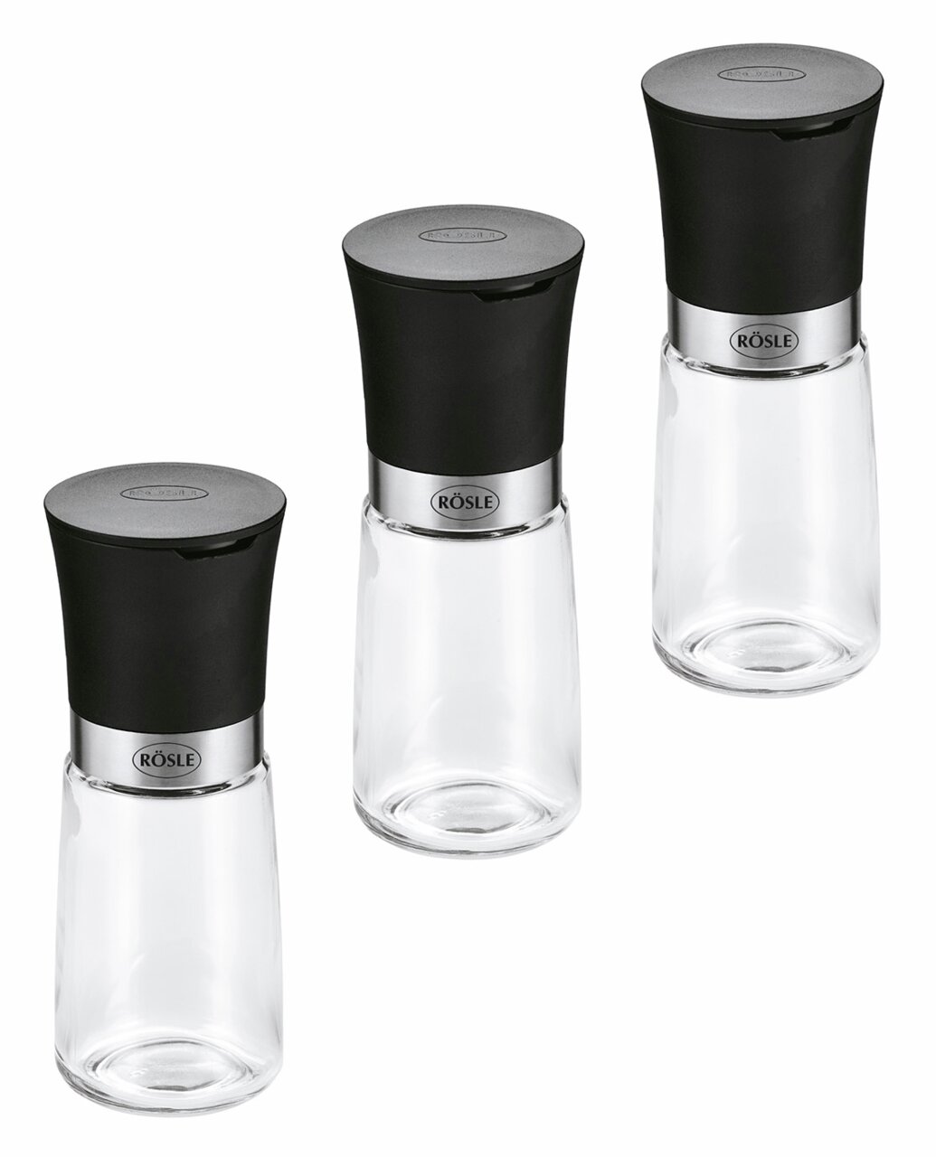 Dreiteiliges Gewürzmühlen-Set mit schwarzem Deckel und transparentem Glasbehälter, aus der Vogelperspektive fotografiert.