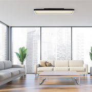 Moderne Deckenleuchte Q-MAGONG von Paul Neuhaus in einem stilvollen Wohnzimmer, aus der Perspektive von unten betrachtet.