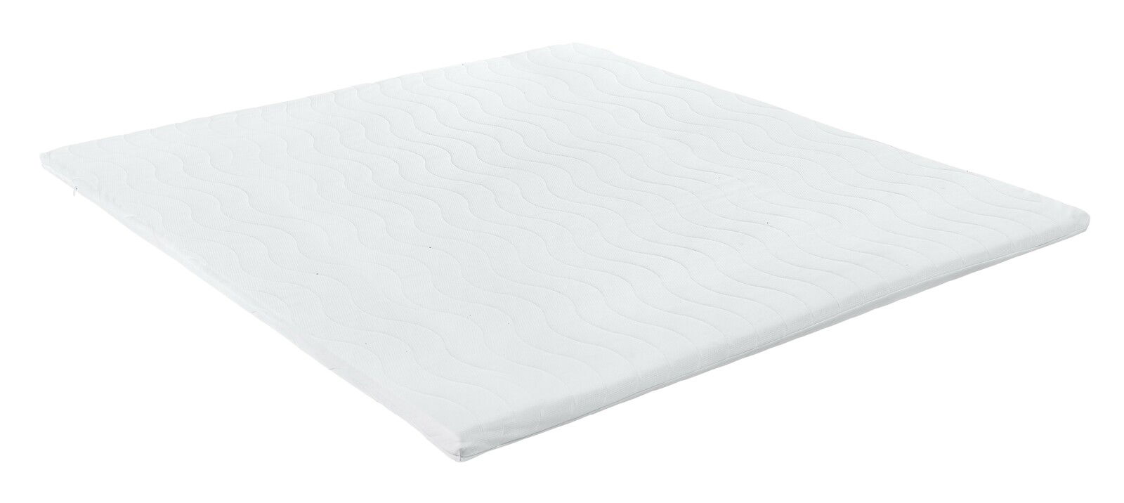 Weißer Matratzen-Topper mit wellenförmigem Muster, schräg von oben fotografiert.