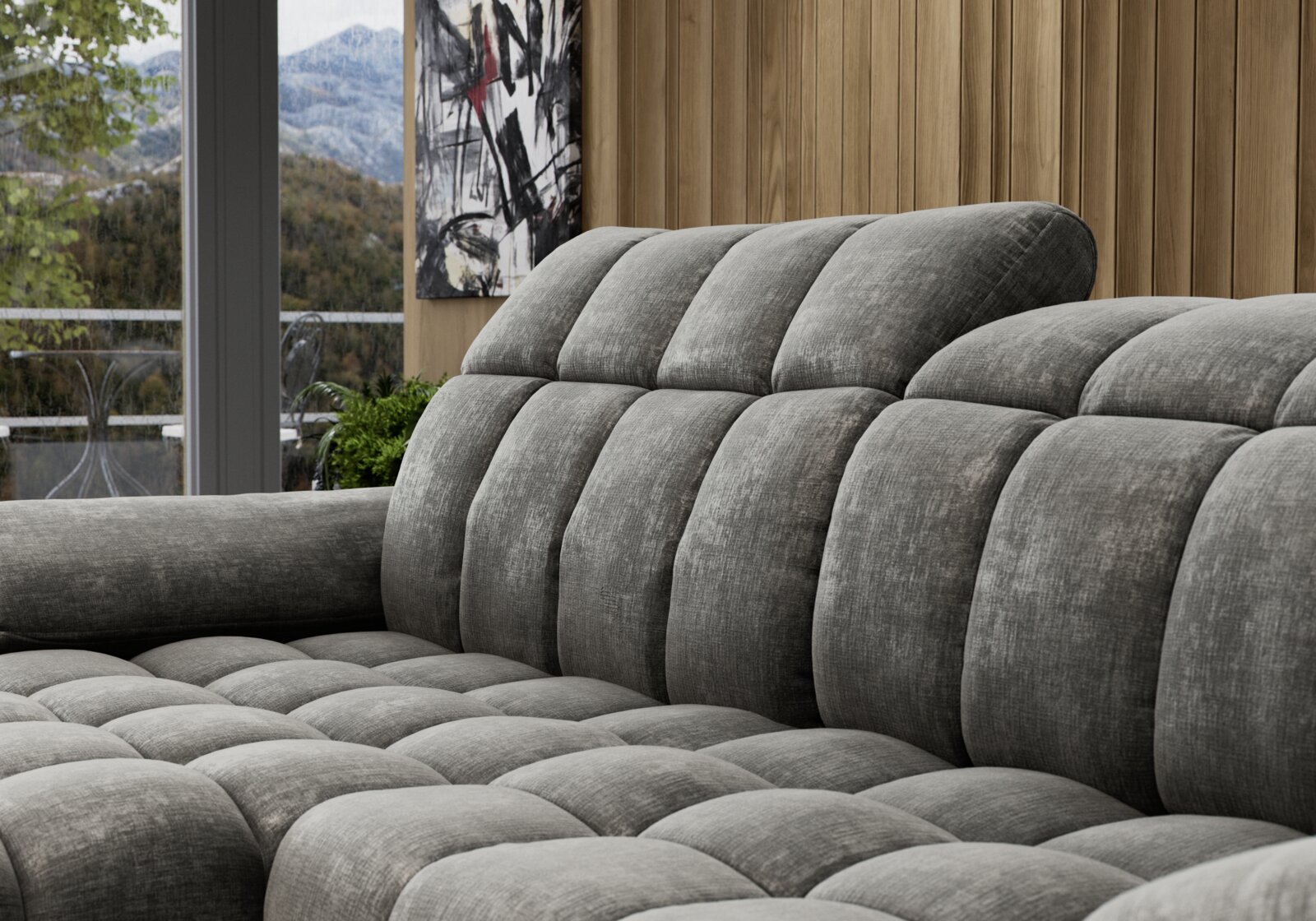 Graues, gepolstertes Longchair-Sofa in einer modernen Wohnzimmerumgebung, seitliche Perspektive.