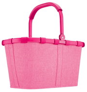 Tragetasche in leuchtendem Pink mit stabilem Griff, seitliche Perspektive