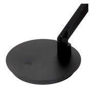 Nahaufnahme der Basis einer schwarzen Tisch- oder Schreibtischleuchte mit modernem Design, von oben betrachtet.