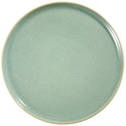 Rond groen keramisch bord met fijn gespikkeld glazuur en beige rand, van bovenaf gezien