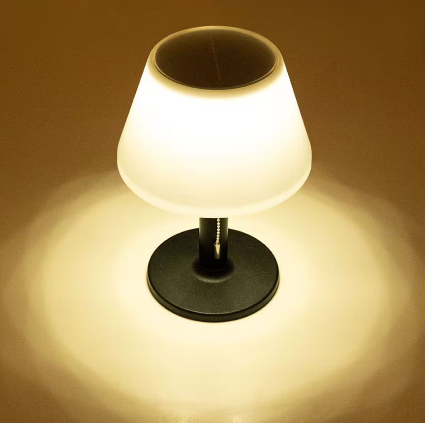 Solar Tischleuchte 28cm in Schwarz, leuchtend in dunkler Umgebung, von oben betrachtet.