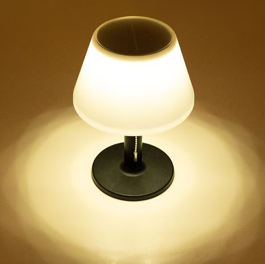 Solar Tischleuchte 28cm in Schwarz, leuchtend in dunkler Umgebung, von oben betrachtet.