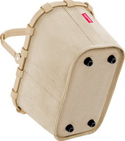 Beige Reisenthel Einkaufskorb mit gerippter Stoffstruktur, stabilem Rahmen und vier schwarzen Standfüßen, schräg von unten/seitlich fotografiert