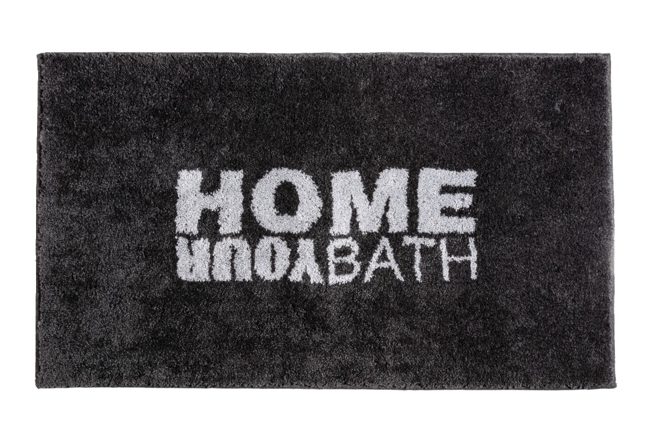 Schwarzer Badteppich mit der Aufschrift 'HOME YOUR BATH' in weißer Schrift, von oben betrachtet.