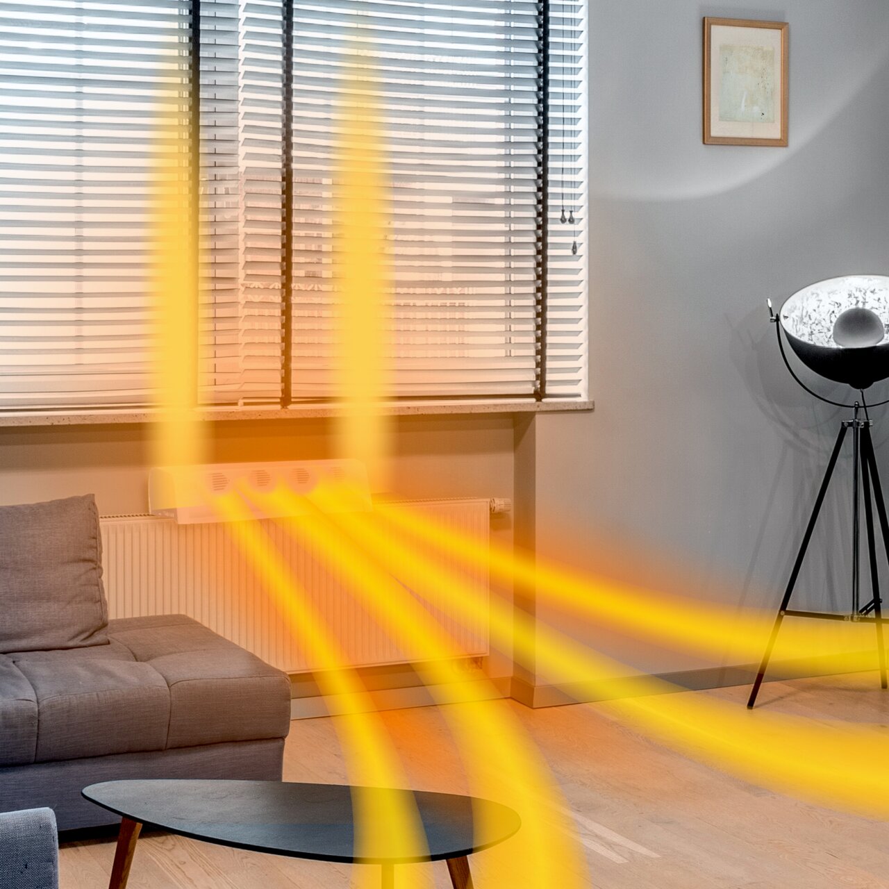 Heizkörper mit Invictus Therma Boost, der warme Luft in einem modernen Wohnzimmer verteilt, seitliche Perspektive