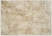 Designer Teppich in beige und braunen Tönen mit einem antiken, verwitterten Muster, aus der Vogelperspektive fotografiert.