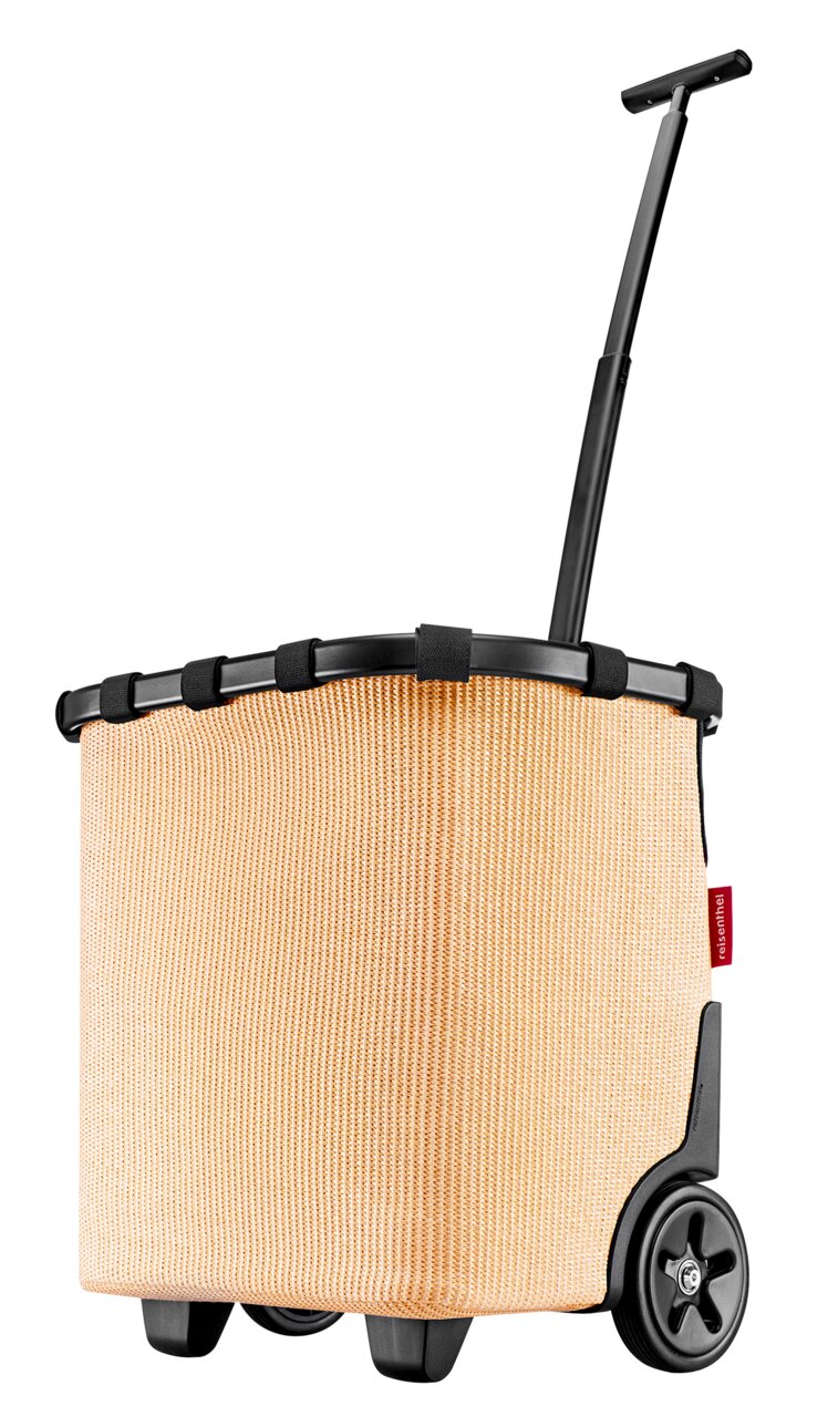 Zijaanzicht van een beige carrycruiser met een zwarte telescoopsteel en wielen.