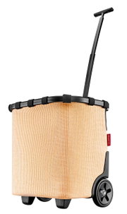 Zijaanzicht van een beige carrycruiser met een zwarte telescoopsteel en wielen.