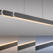 Moderne Pendelleuchte ADRIANA ROUND von Paul Neuhaus in seitlicher Perspektive, mit elegantem, langem Design und warmweißer Beleuchtung.