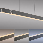 Moderne Pendelleuchte ADRIANA ROUND von Paul Neuhaus in seitlicher Perspektive, mit elegantem, langem Design und warmweißer Beleuchtung.