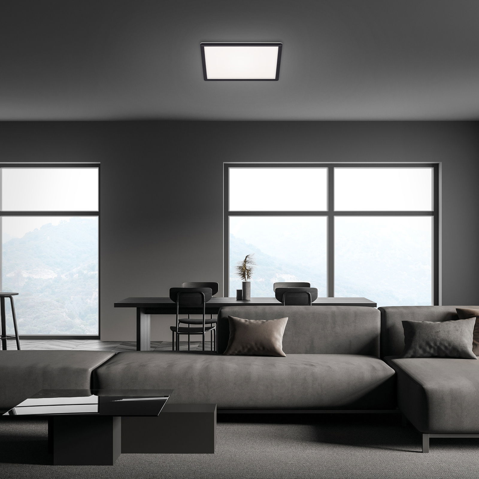 Moderne LED-Deckenleuchte in einem stilvollen Wohnzimmer, Perspektive von unten.