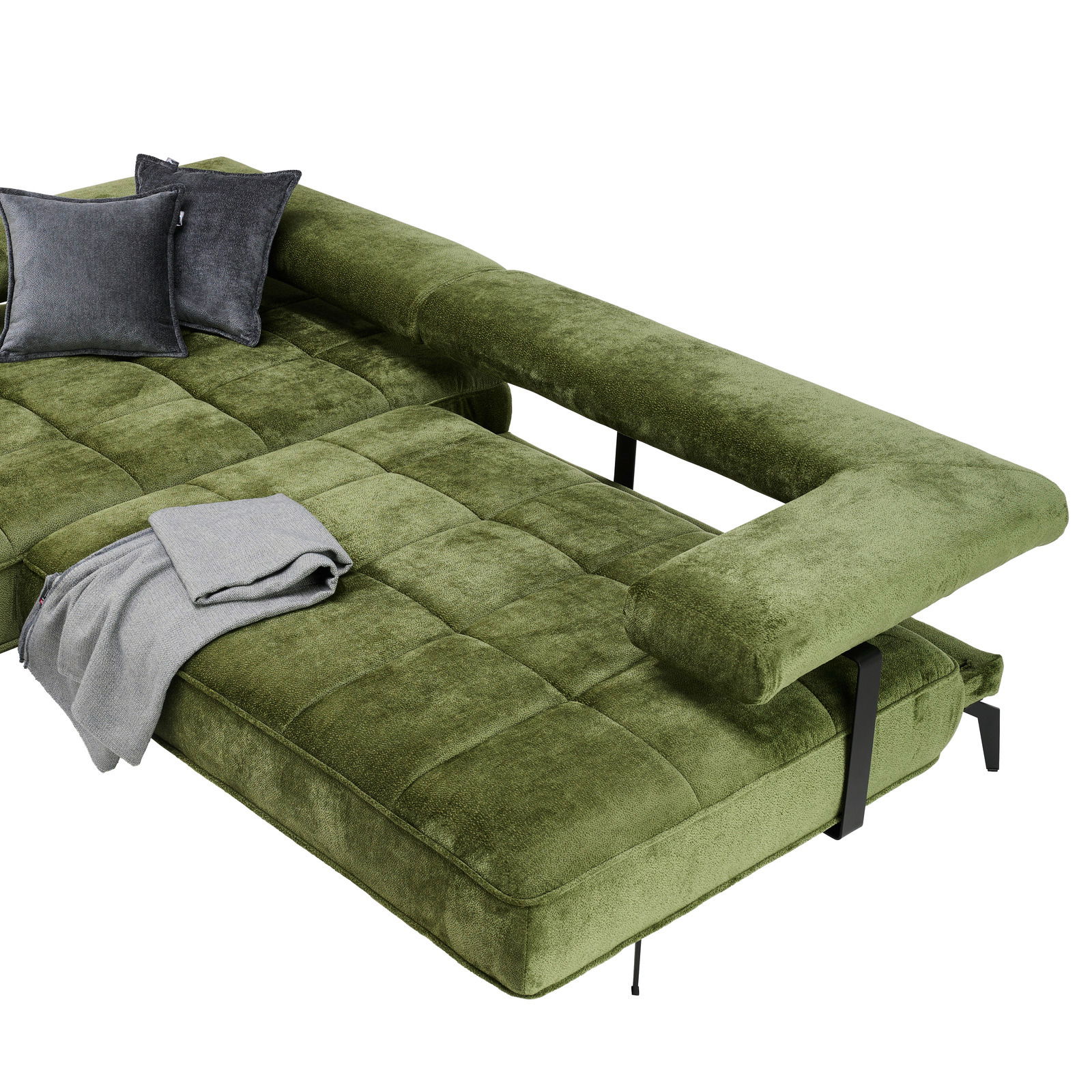 Grüne Longchairkombination mit samtiger Oberfläche, zwei grauen Kissen und einer grauen Decke, aus der Vogelperspektive betrachtet.