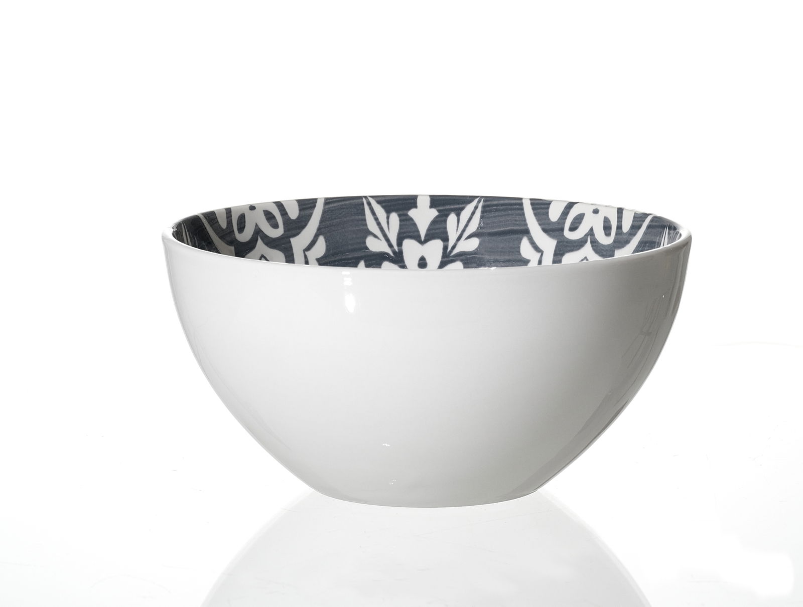 Schüssel mit weißer Außenseite und dekorativem, grauem Muster auf der Innenseite, seitliche Perspektive
