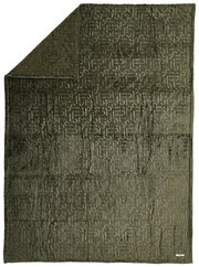 Grünes Plaid mit eingeprägtem Muster, ausgebreitet in der Draufsicht