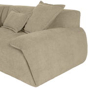 Beige Rundecke Sofa mit Kissen, seitliche Perspektive