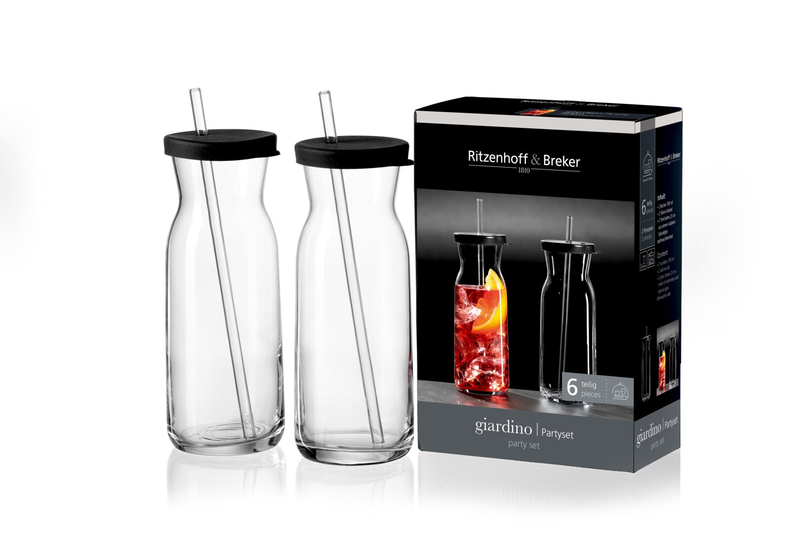 Ritzenhoff & Breker Partyset 6-tlg. GIARDINO Zwei transparente Glaskaraffen mit schwarzen Deckeln und integrierten Trinkhalmen, neben einer Verpackung mit der Aufschrift 'Ritzenhoff & Breker giardino Partyset 6-teilig'. Perspektive: Frontalansicht.