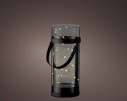 Zylindrische Solar-Laterne aus Acryl mit schwarzem Griff, beleuchtet mit kleinen Lichtern, seitliche Perspektive