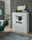 Modernes weißes Highboard mit dekorativer Beleuchtung, frontal fotografiert, umgeben von stilvoller Dekoration und Pflanzen.