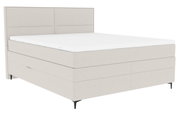 Boxspringbett in seitlicher Perspektive mit hellem Stoffbezug und schlichtem Design