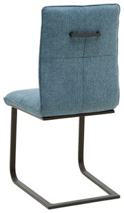Achterkant van een sledestoel met blauwe stoffen bekleding en een zwart metalen frame.