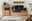 Moderne Wandkombination aus Holz mit TV-Schrank, Regal und Dekorationen, frontal betrachtet.
