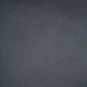 Nahaufnahme einer dunkelgrauen, strukturierten Oberfläche eines Stuhlsitzes