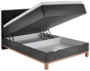 Boxspringbett mit geöffnetem Stauraum, seitliche Perspektive