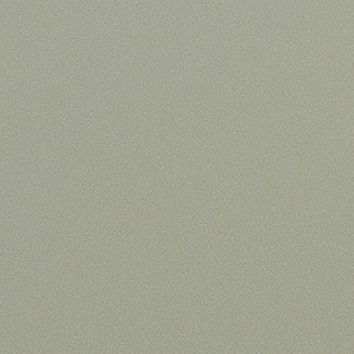 Nahaufnahme einer grünlichen Textur, möglicherweise eine Oberfläche eines Möbelstücks.