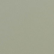 Nahaufnahme einer grünlichen Textur, möglicherweise eine Oberfläche eines Möbelstücks.