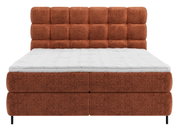 Boxspringbett in Rostrot mit gepolstertem Kopfteil, Frontalansicht