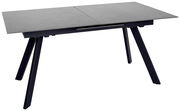 Moderner Esstisch mit grauer Tischplatte und schwarzen, schrägen Beinen, seitliche Perspektive