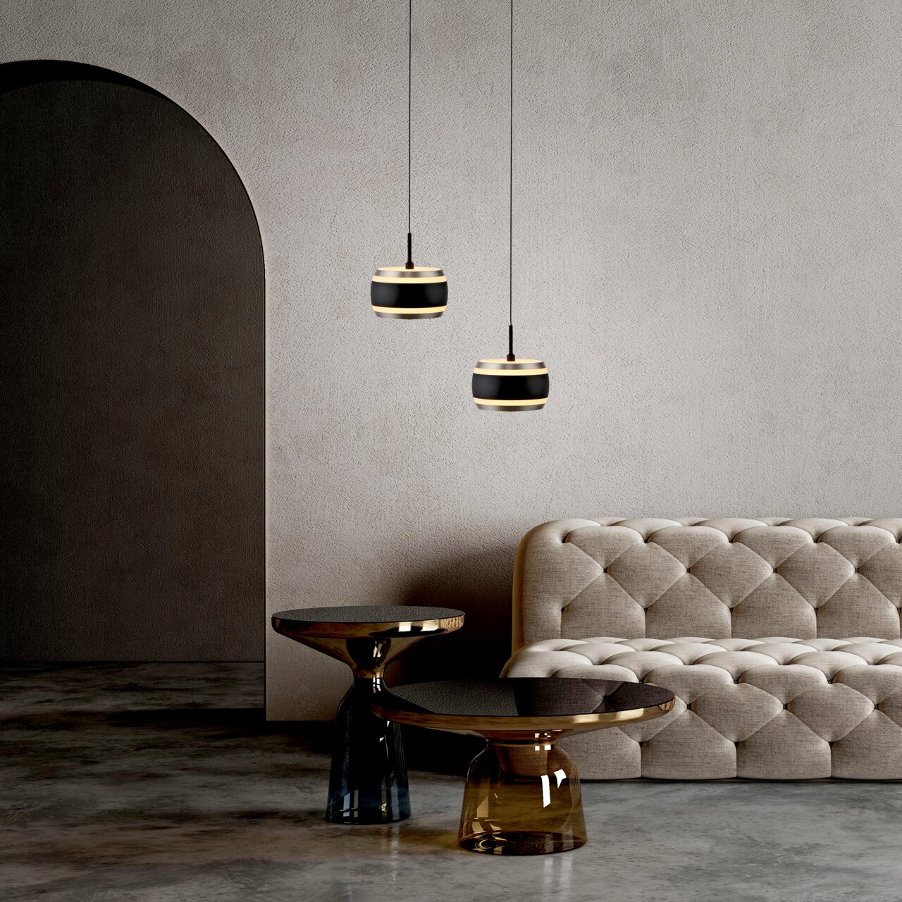 Neuhaus Pure LED-Pendelleuchte PURE FALLING RINGS Zwei moderne LED-Pendelleuchten in einem eleganten Raum mit einem beigen Sofa und stilvollen Beistelltischen, seitliche Perspektive.