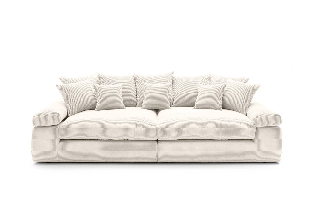 Großes, cremefarbenes Big-Sofa mit mehreren Kissen, Vorderansicht