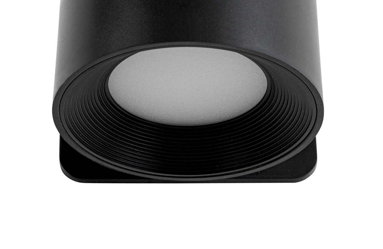 Nahaufnahme einer schwarzen, zylindrischen Akku-Wandleuchte von unten betrachtet.