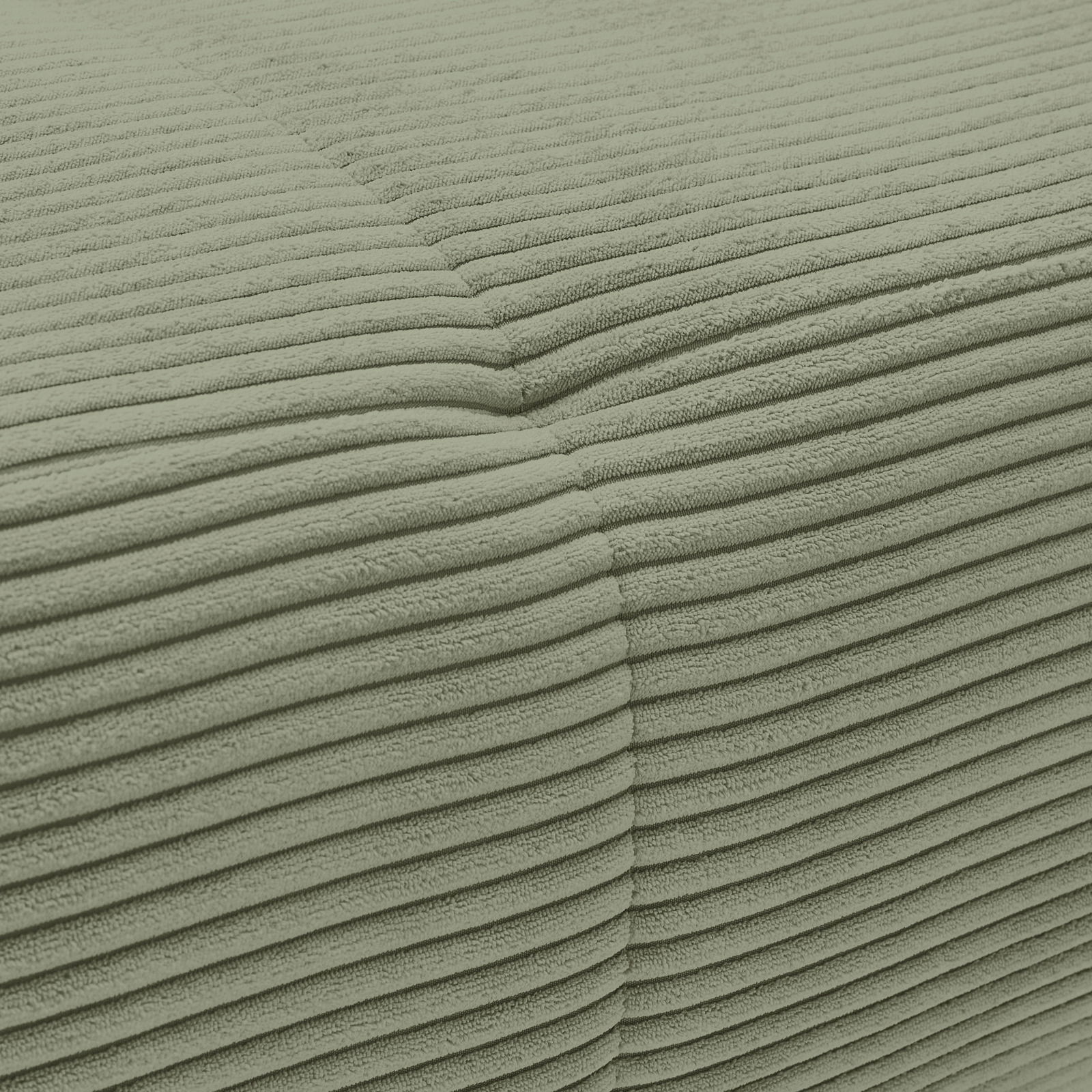 Nahaufnahme einer grünen, gerippten Stoffoberfläche eines Sofas aus der Vogelperspektive.