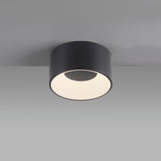 Moderne Deckenleuchte TANIKA in zylindrischer Form, schwarze Oberfläche, von unten betrachtet.