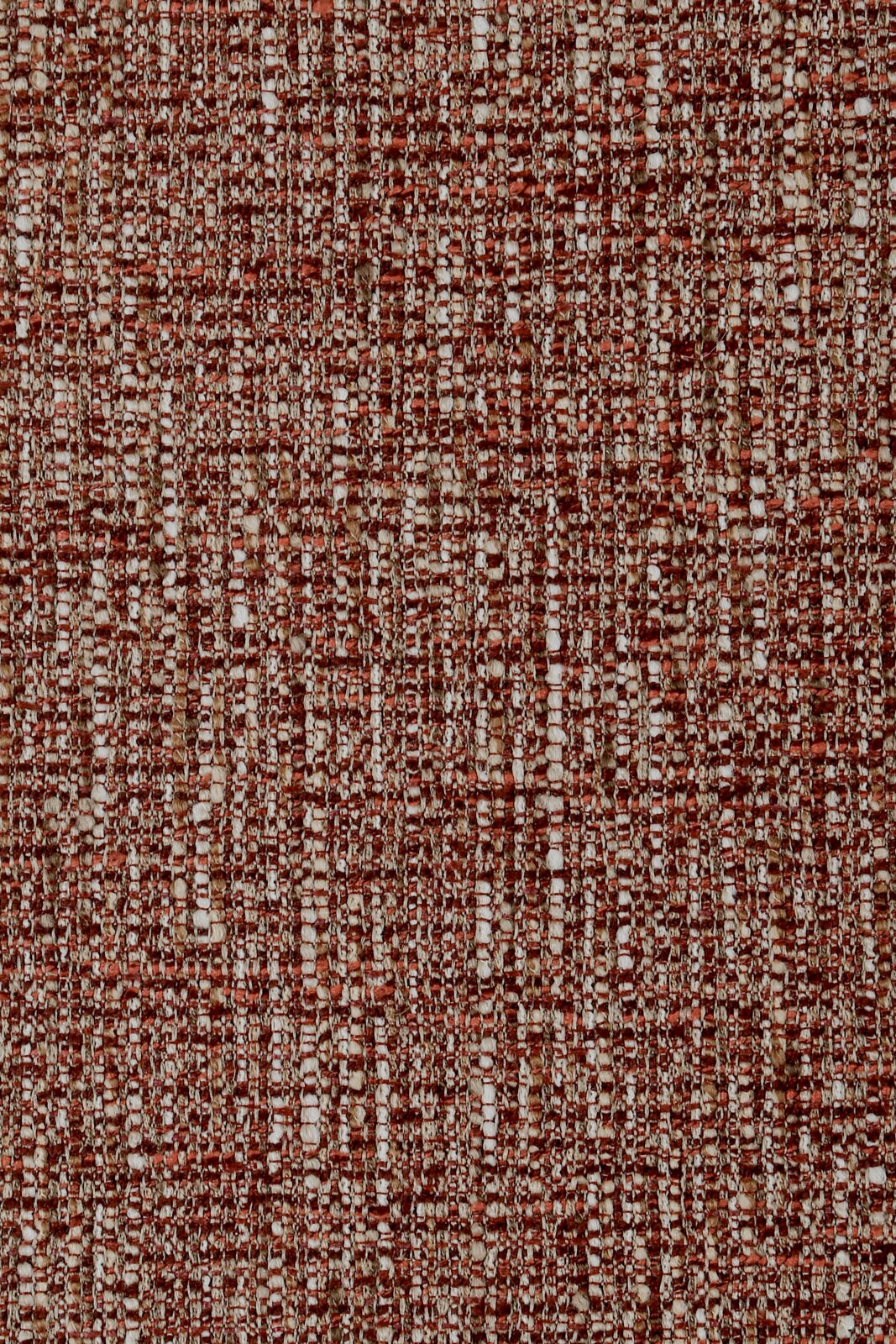 Novel Fauteuil ELVIY Close-up van een gestructureerd, roodbruin stoffenpatroon dat wordt gebruikt voor een fauteuil.