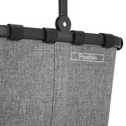 Close-up van het bovenste deel van een grijs Carrybag-frame met een zwarte handgreep en de tekst 'Position'.