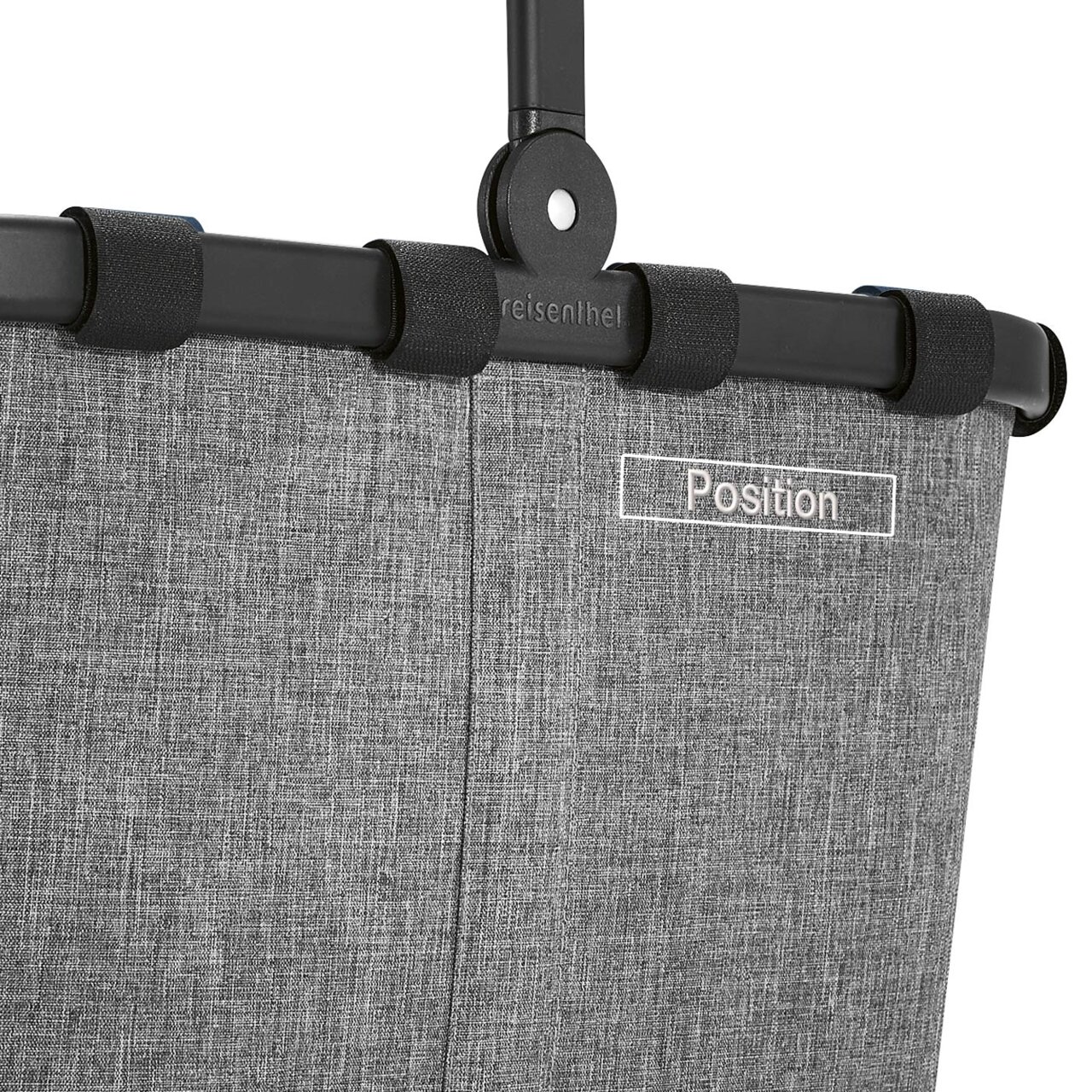 Close-up van het bovenste deel van een grijs Carrybag-frame met een zwarte handgreep en de tekst 'Position'.