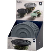 Silikondeckel in Anthrazit, präsentiert in einer Verkaufsverpackung, von schräg oben fotografiert.