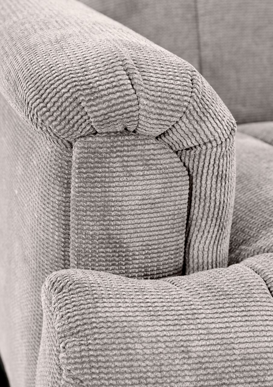 Nahaufnahme einer grauen, strukturierten Polsterung einer 2er-Sitzbank, Perspektive von der Seite.